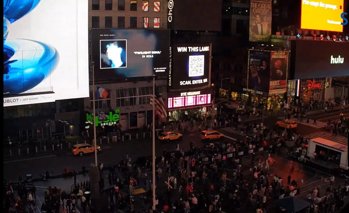 Veils on the Times Square billboard at night